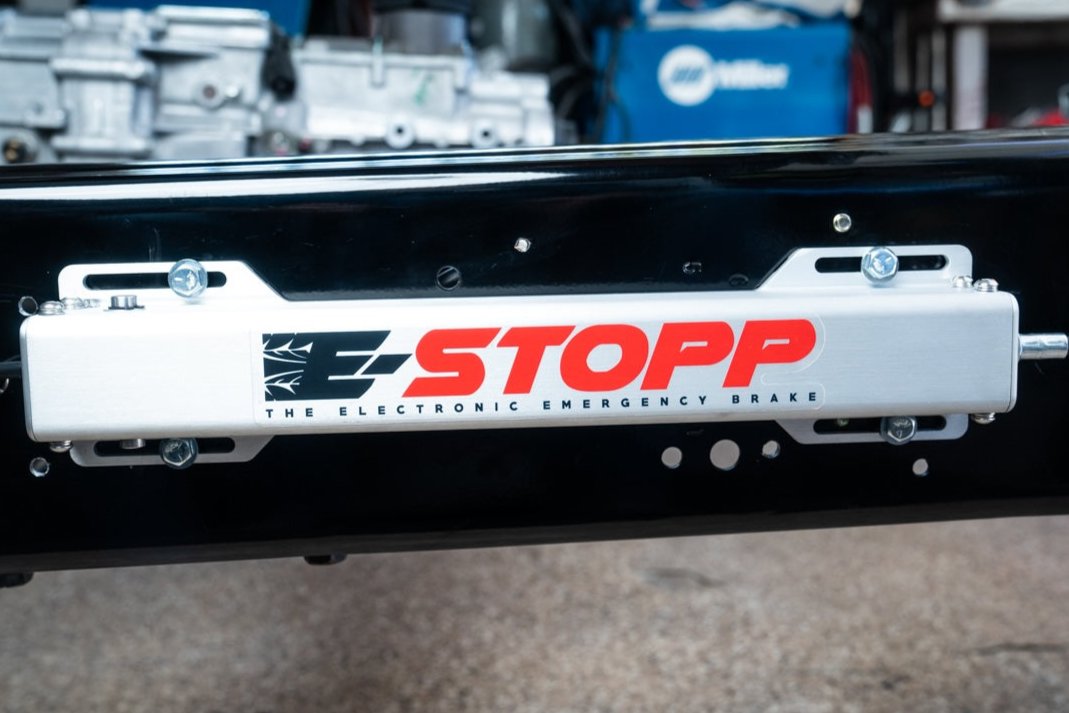 E-Stopp silver actuator installed on a chassis frame rail