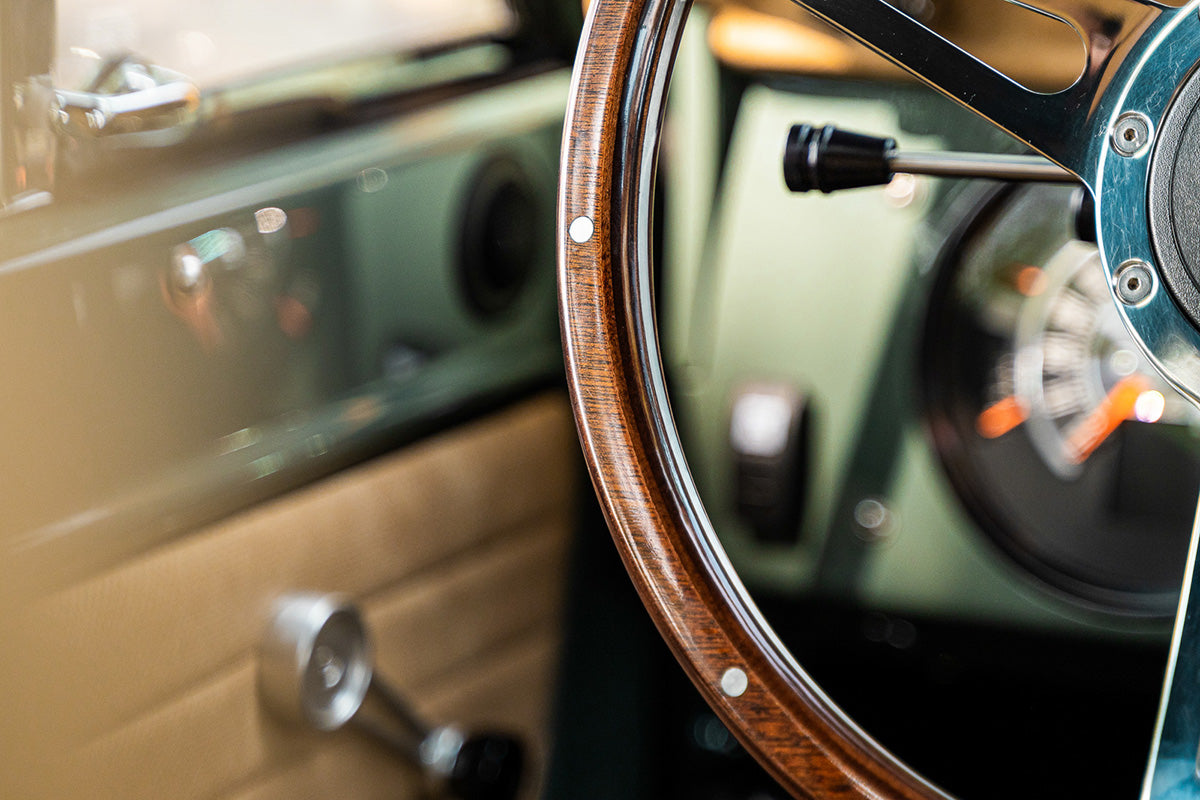 Close up of the Highline Classics custom green Bronco's steering wheel