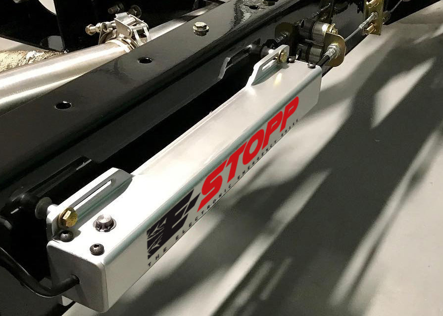 E-Stopp silver actuator installed on a chassis frame rail