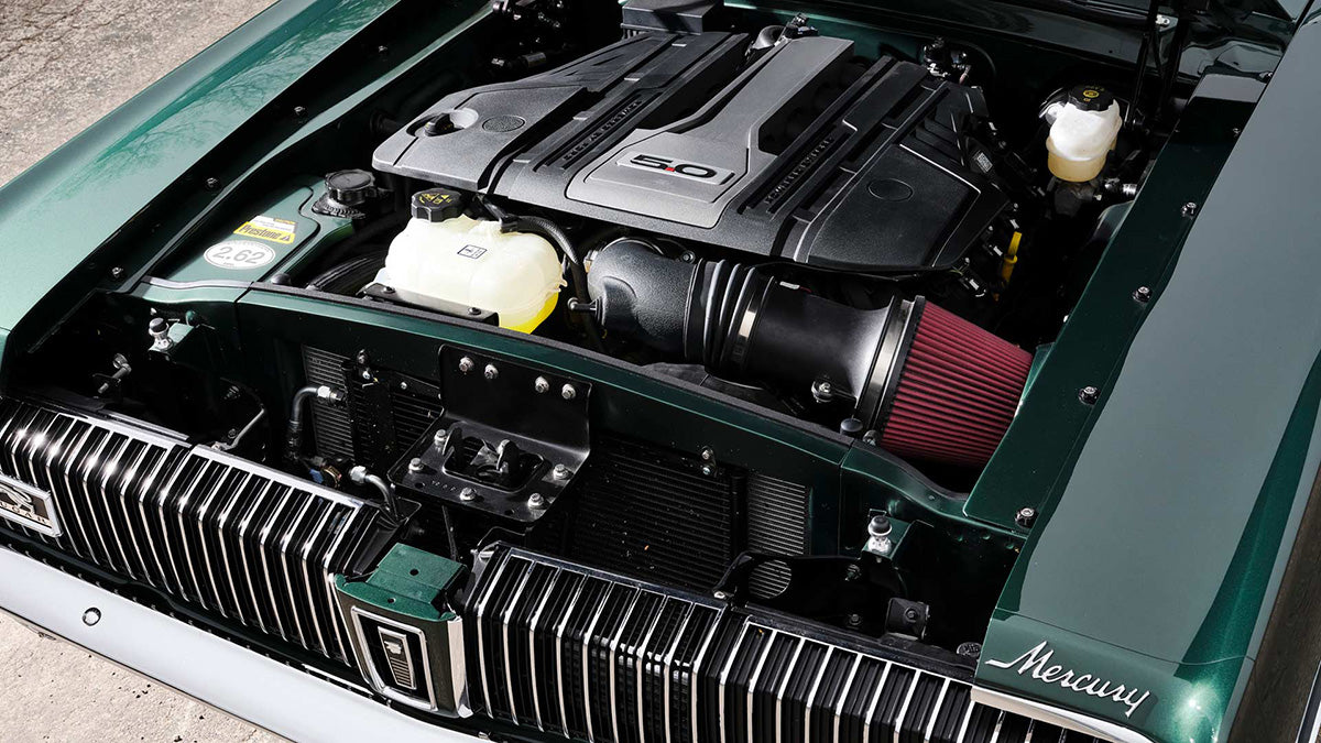 Open hood of the Ringbrothers 1968 Cougar showing engine