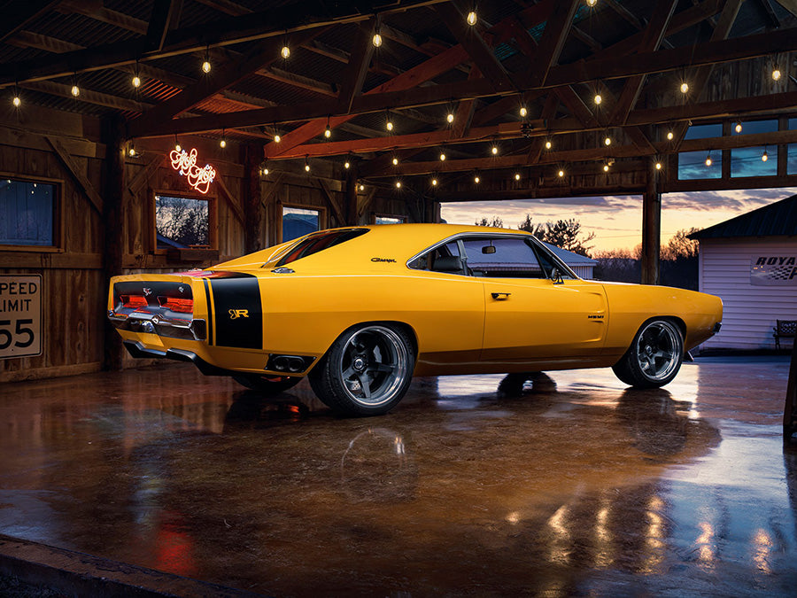 Ringbrothers 1969 Dodge Charger in a rustic garage at sunset